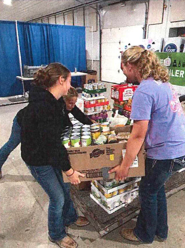 Youth stacking canned goods