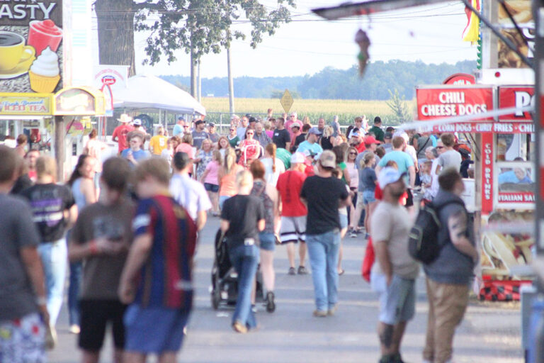 A crowded midway at the 2023 Hardin County Fair.